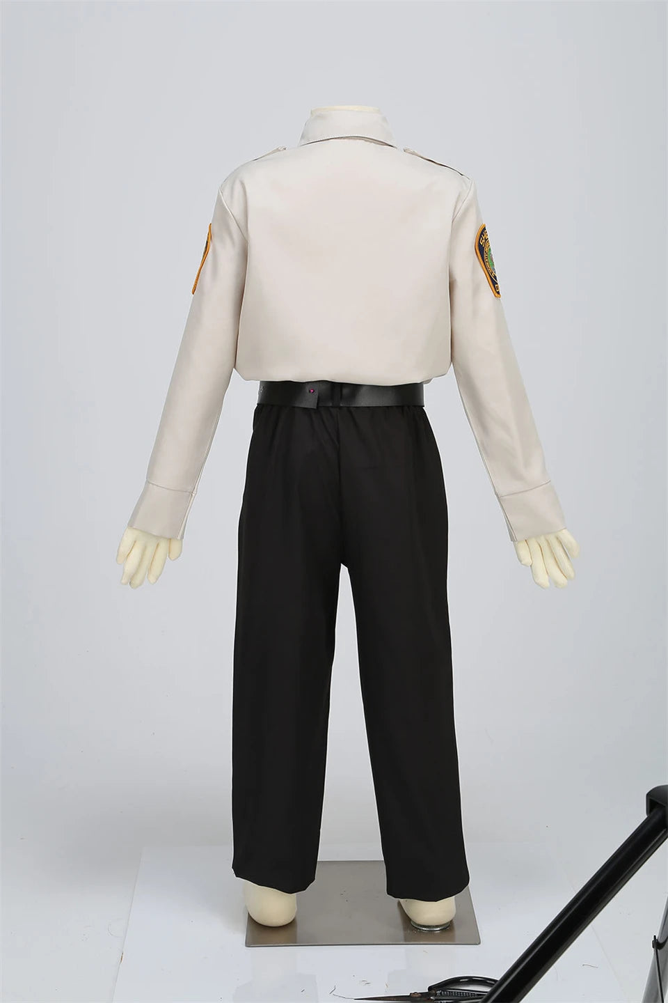 Kids Police Costume Set rear mannequin view showing the shirt sleeves, waistband, and trouser legs.