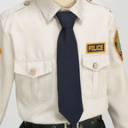 Kids Police Costume Set tight chest detail showing the navy tie, buttoned pockets, and POLICE patch.
