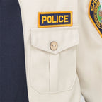 Kids Police Costume Set close-up of the yellow POLICE chest patch above a buttoned pocket.