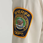 Kids Police Costume Set close-up of the embroidered SHERIFF DEPT. sleeve patch.