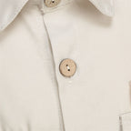 Kids Police Costume Set close-up of the beige shirt front button, buttonhole, and fabric texture.