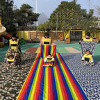 Kids Rainbow Pull Game Mat in the middle of a playground group activity with separate long fabric tracks