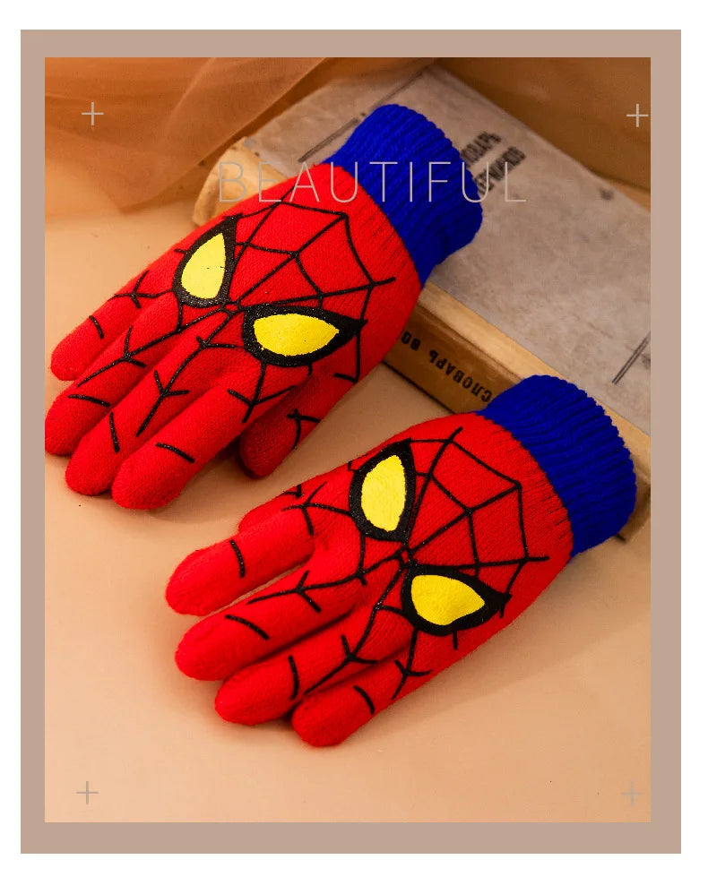 Red kids spider web gloves with blue cuffs in a bordered promotional image.