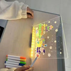 LED Acrylic Writing Board viewed from the side as a person draws Christmas decorations with a pen