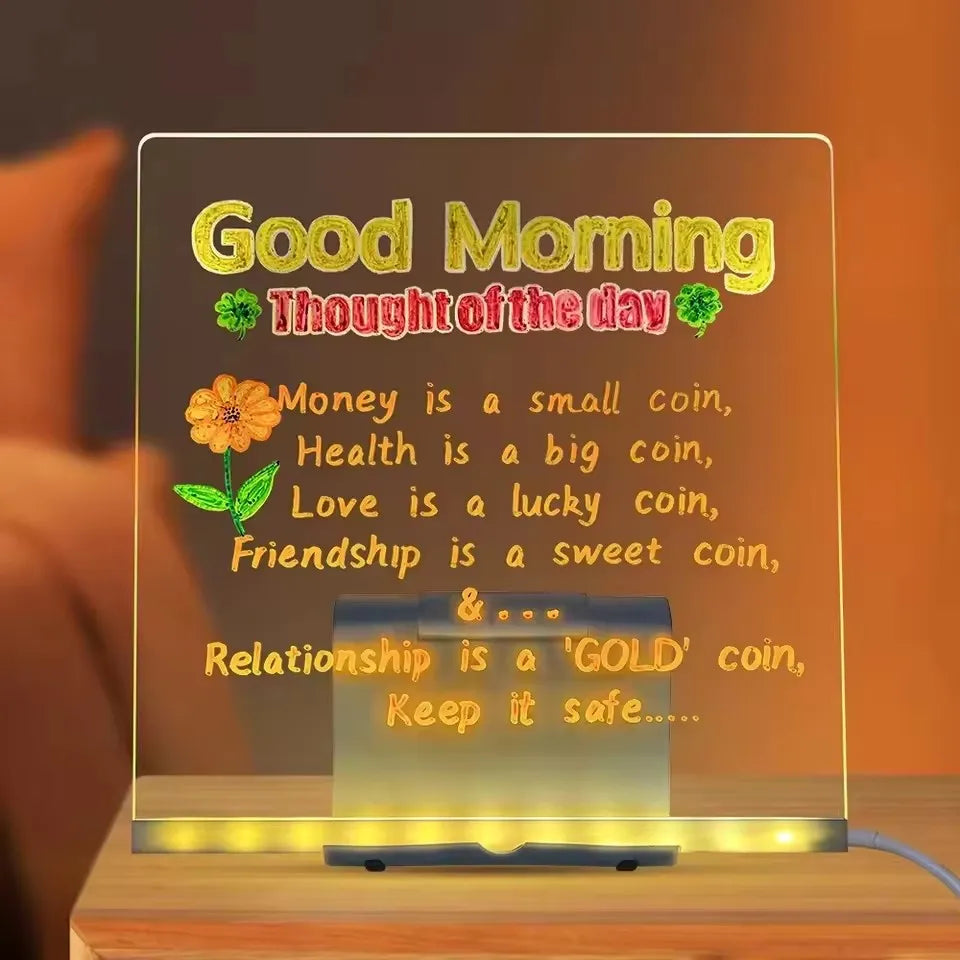 LED Acrylic Writing Board on a stand displaying a colorful Good Morning message and flower drawing