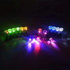 LED Color Changing Earrings arranged in a multicolor glowing display with red, green, blue, and purple lights