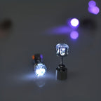 LED Color Changing Earrings pair emitting a bright white glow against a dark neutral background