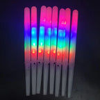 LED Cotton Candy Sticks standing upright with glowing multicolor ribbed shafts and white handles.