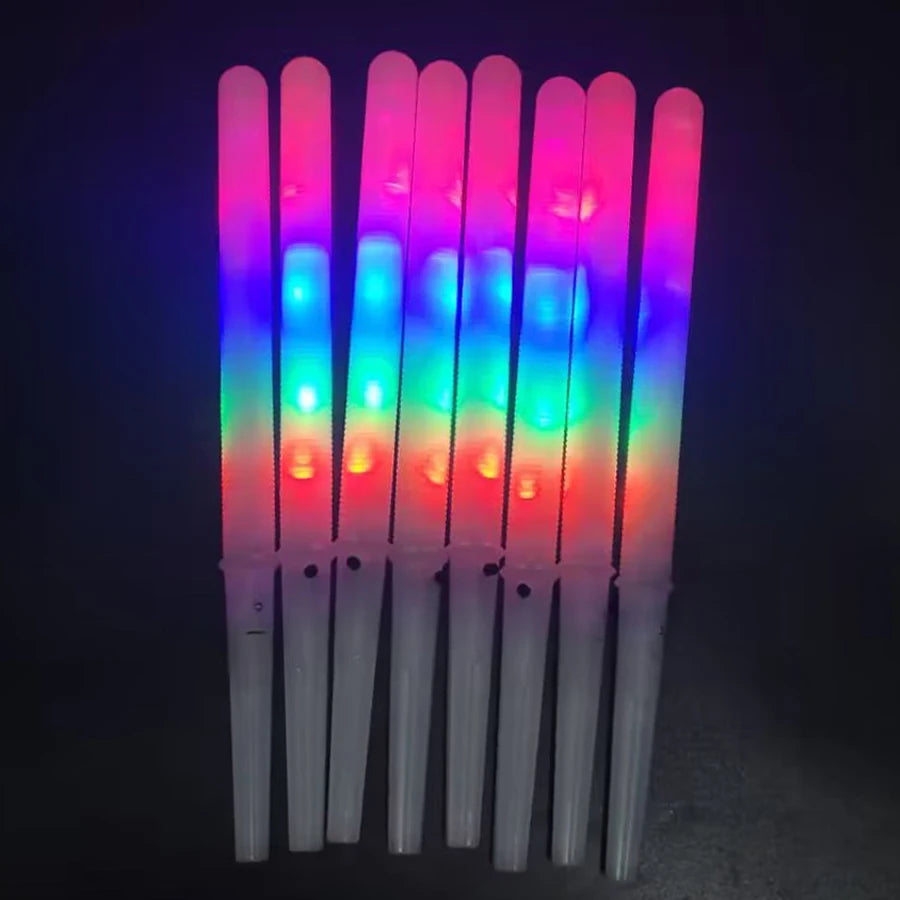 LED Cotton Candy Sticks standing upright with glowing multicolor ribbed shafts and white handles.