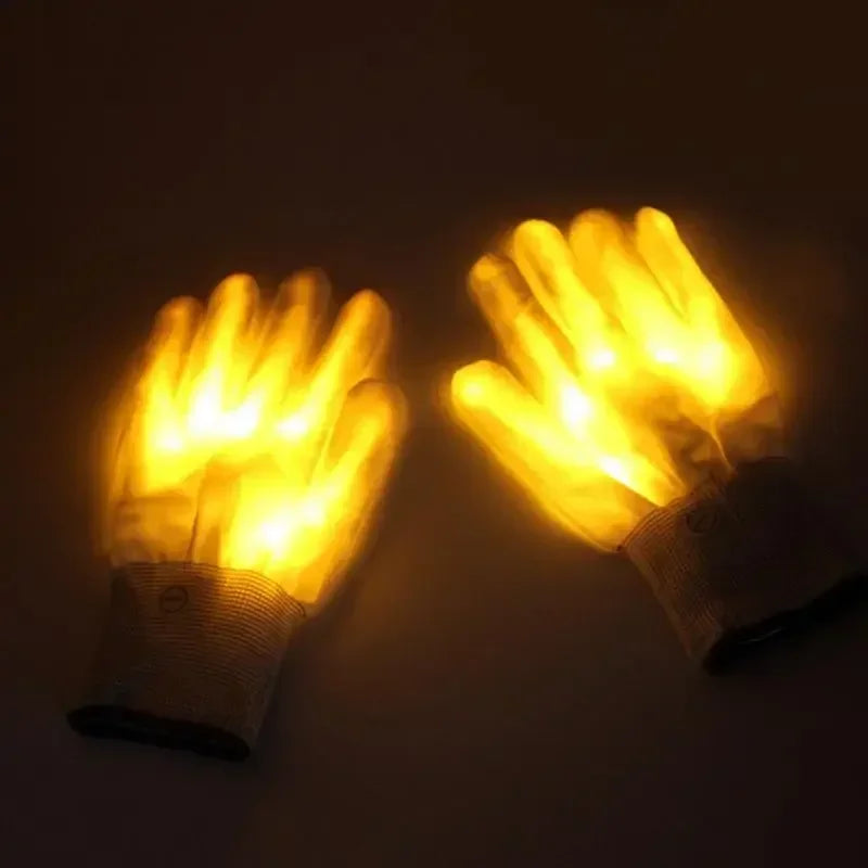 LED Glowing Skeleton Gloves with yellow illumination, laid side by side with cuff buttons visible.