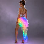 LED Light-Up Tutu Skirt modeled from behind with luminous rainbow layers and a sheer trailing hem.
