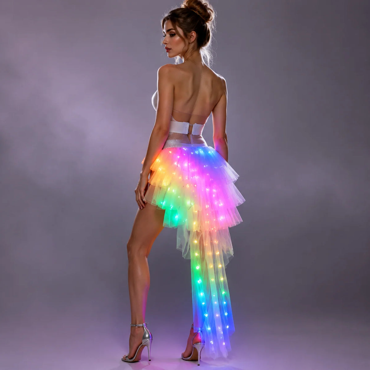 LED Light-Up Tutu Skirt worn with silver heels, showing rainbow lights along the flowing rear train.