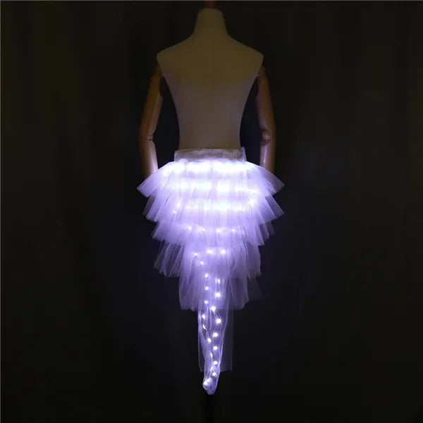 LED Light-Up Tutu Skirt with white LEDs glowing through layered tulle and a long rear train.