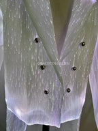 LED Light-Up Tuxedo close-up of the glowing jacket fabric, lapels, and six black buttons
