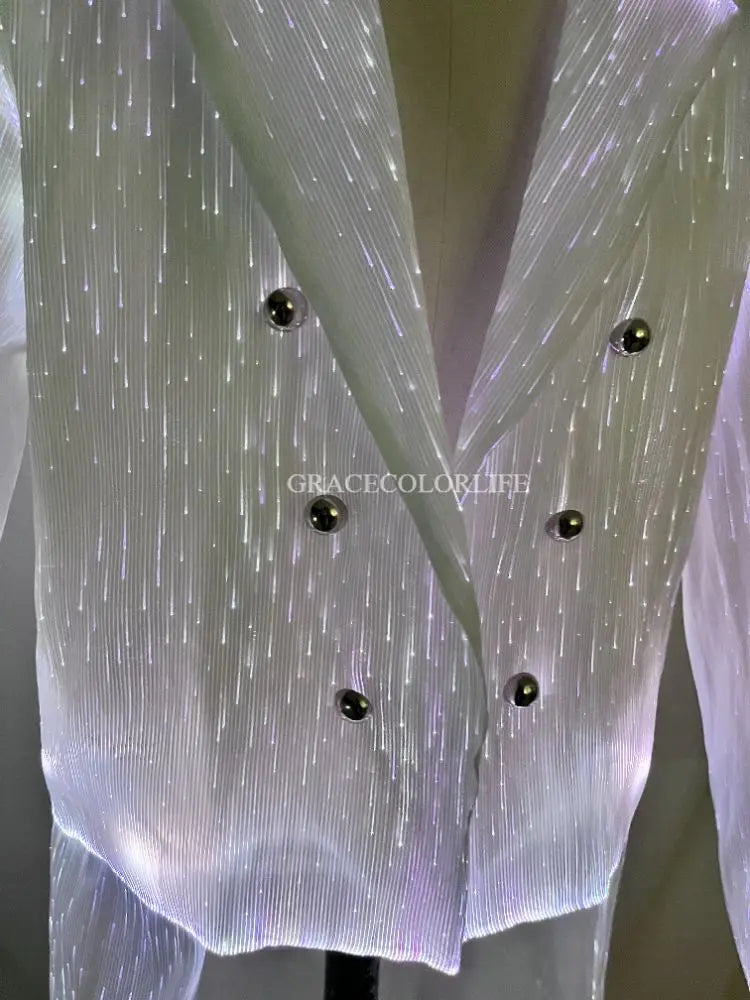 LED Light-Up Tuxedo close-up of the glowing jacket fabric, lapels, and six black buttons