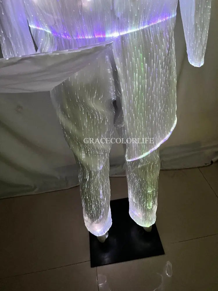 LED Light-Up Tuxedo close-up of white illuminated pants beneath the lifted jacket tail