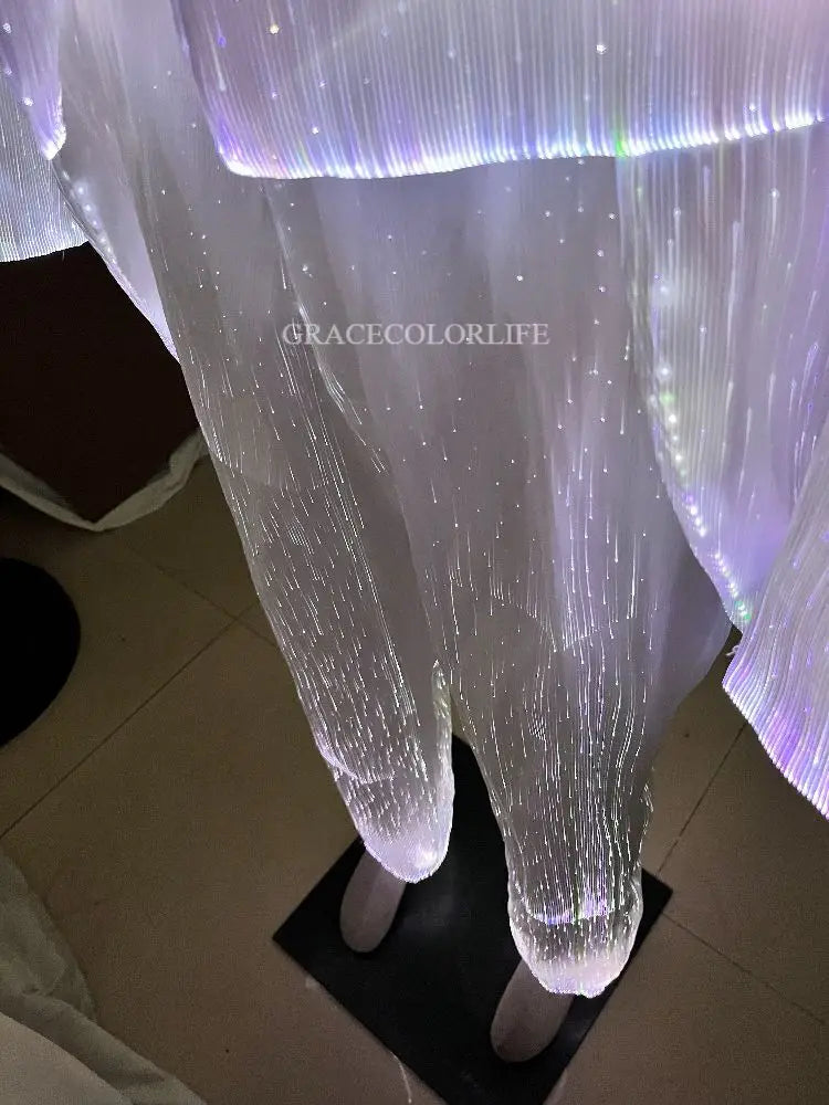 LED Light-Up Tuxedo close-up of illuminated white pants and the jacket’s lower edge