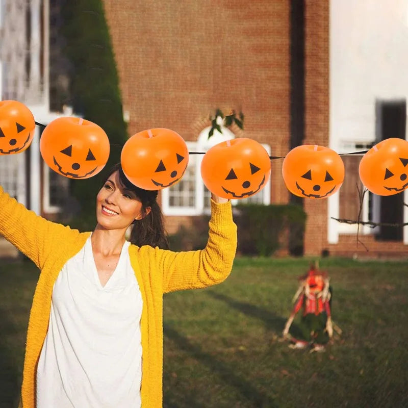Luminous Halloween Balloons arranged in an outdoor Halloween garland display