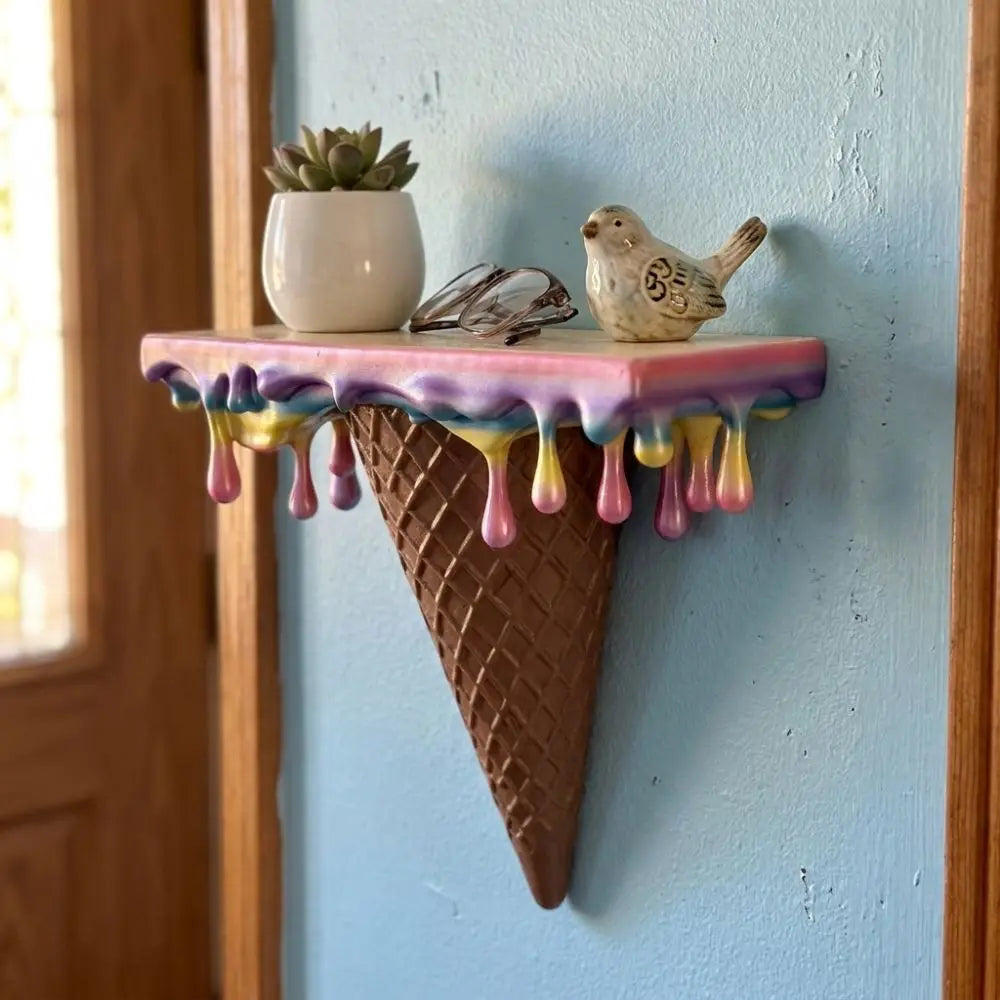 Melting Ice Cream Shelf in Colorful finish on a blue wall with a plant and small decor