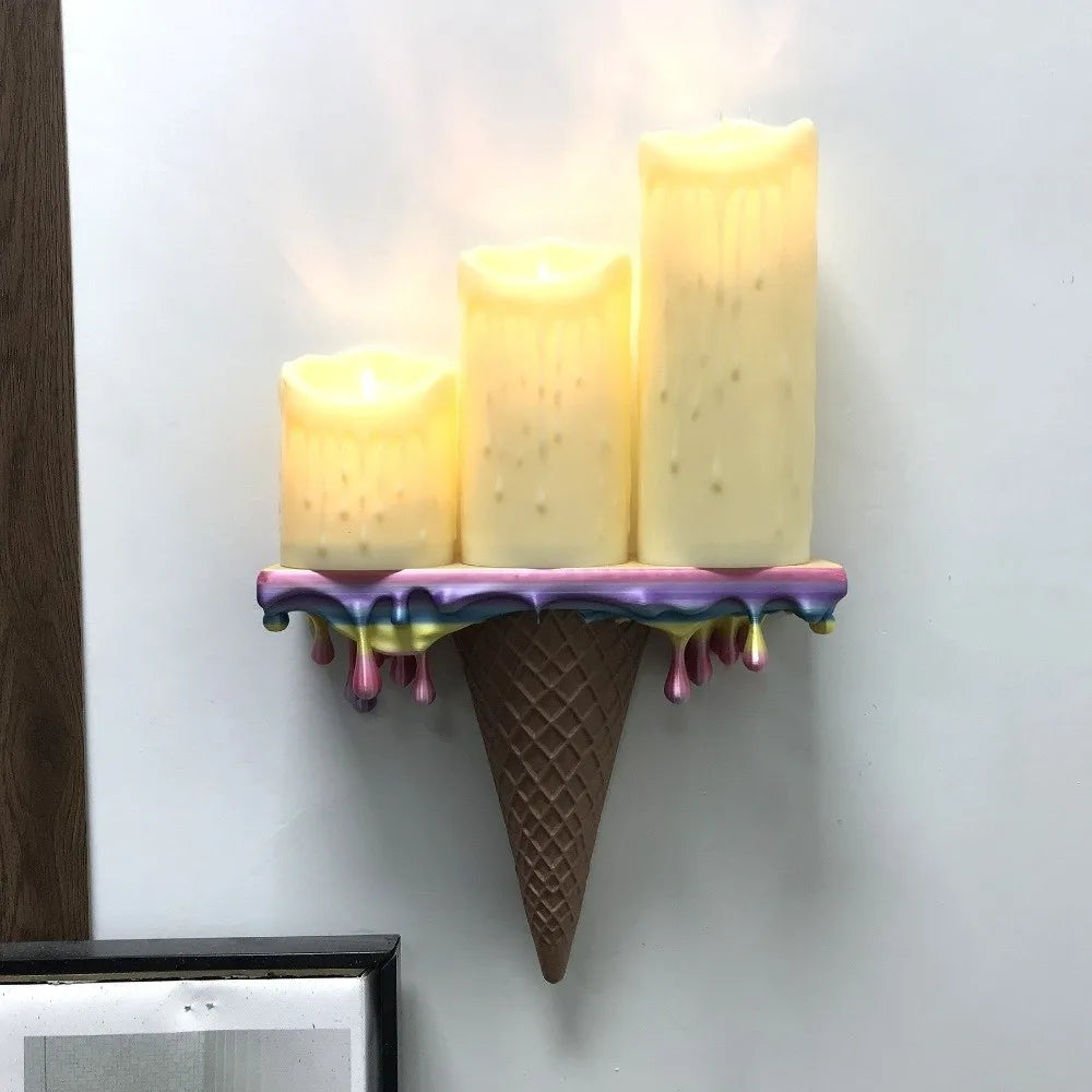 Melting Ice Cream Shelf in Colorful finish displaying three glowing pillar candles