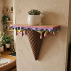 Melting Ice Cream Shelf in Colorful finish shown close up with a small potted plant