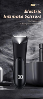 Men’s Groin Trimmer in black standing on a dark bathroom countertop with its digital battery display visible