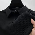 Men's Valor Textured Polo in black showing collar and textured fabric