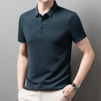 Man wearing the blue Men's Valor Textured Polo in an angled pose