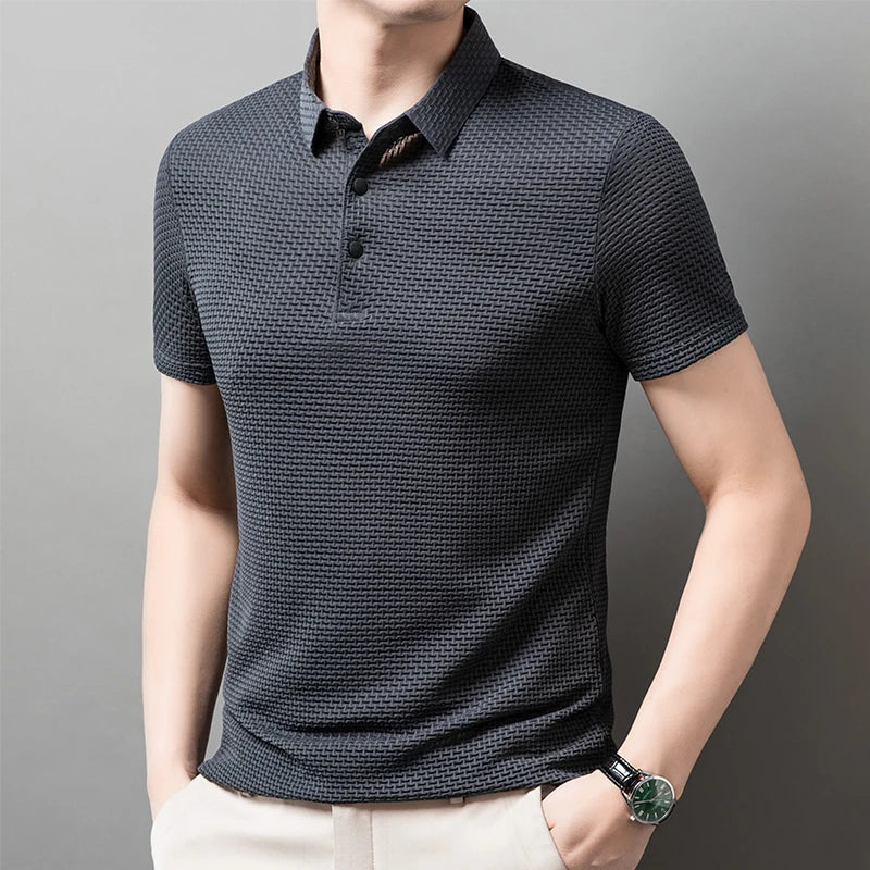 Man wearing the gray Men's Valor Textured Polo in a side pose