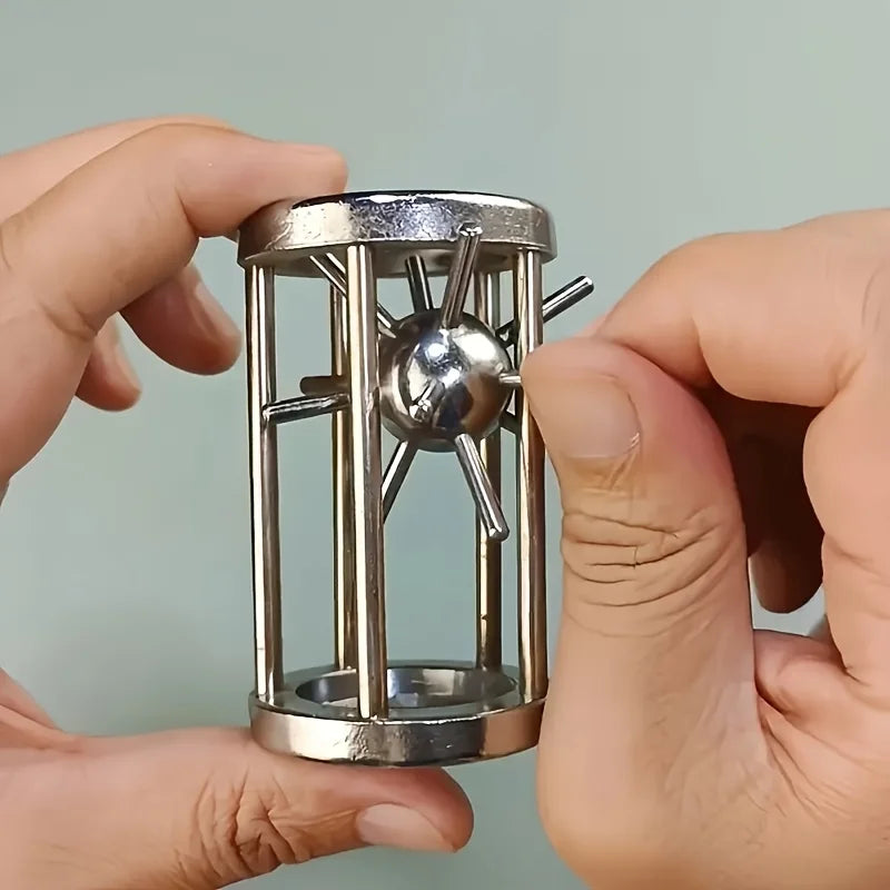 Metal Cage Challenge held in both hands while the spiked ball is guided through the steel cage