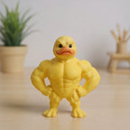 Yellow muscular duck figurine front display on a wooden desk