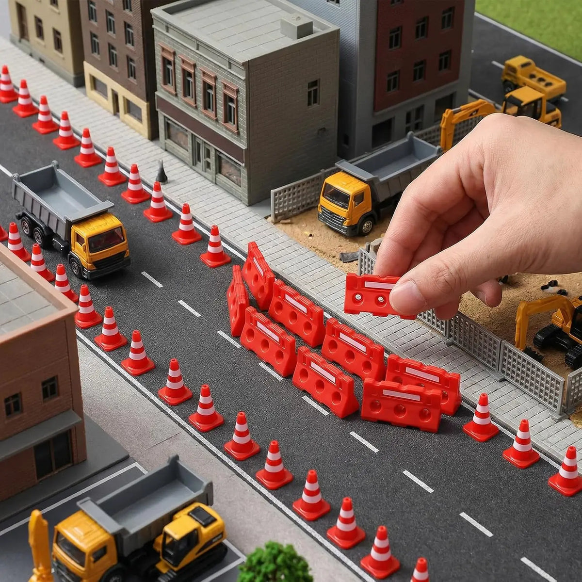 Mini Construction Zone Set arranged along a model city road as a hand positions a barricade.