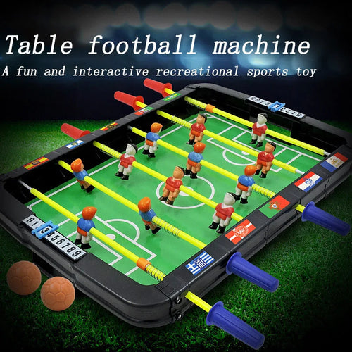 Mini Tabletop Foosball Game with red and blue handles, green soccer pitch, and two balls beside it.
