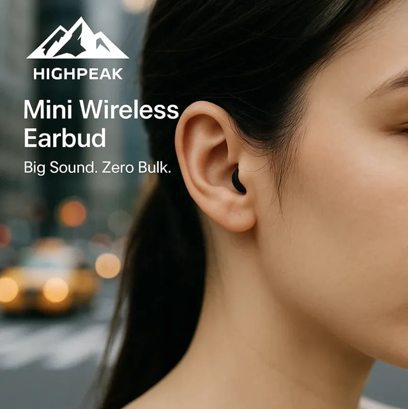 HighPeak Mini Wireless Earbud in black worn discreetly in ear outdoors, showcasing compact, lightweight Bluetooth earbuds.