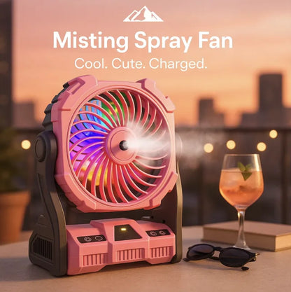 HighPeak Misting Spray Fan in pink with LED lights and mist spray on outdoor table at sunset cooling scene