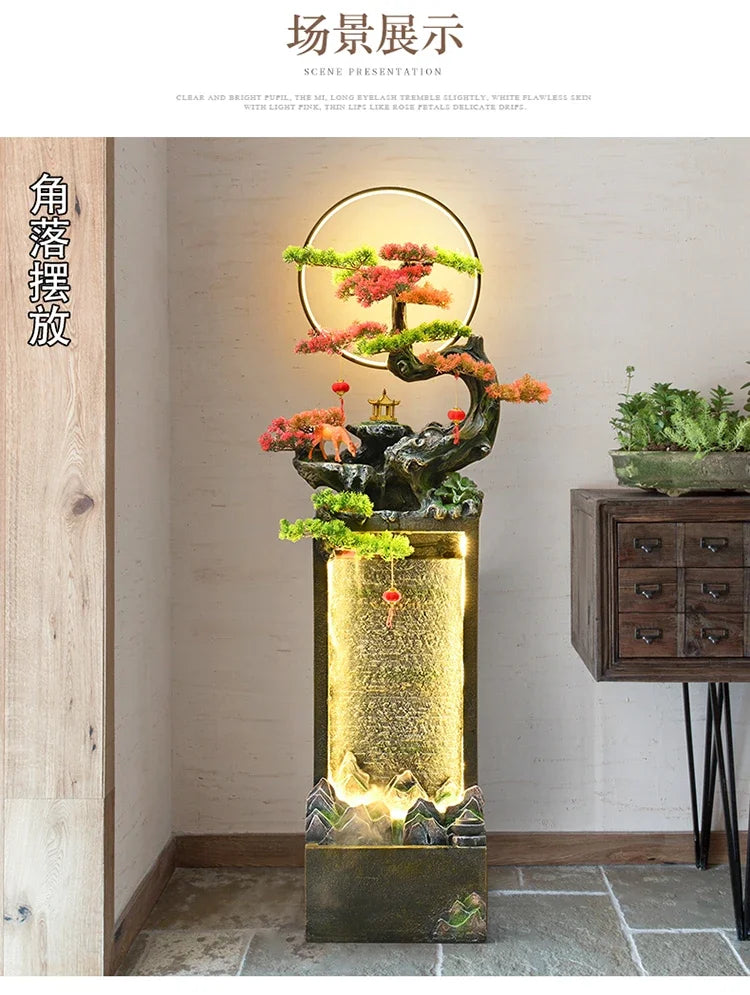 Moonlit Bonsai Waterfall displayed in an indoor corner beside a raised wooden drawer cabinet and greenery.