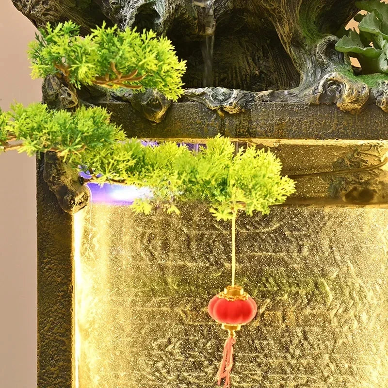 Moonlit Bonsai Waterfall close-up of green decorative foliage and a red lantern above the glowing water panel.