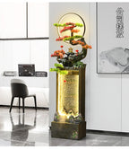 Moonlit Bonsai Waterfall displayed near an office reception desk with large windows and gray wall art.