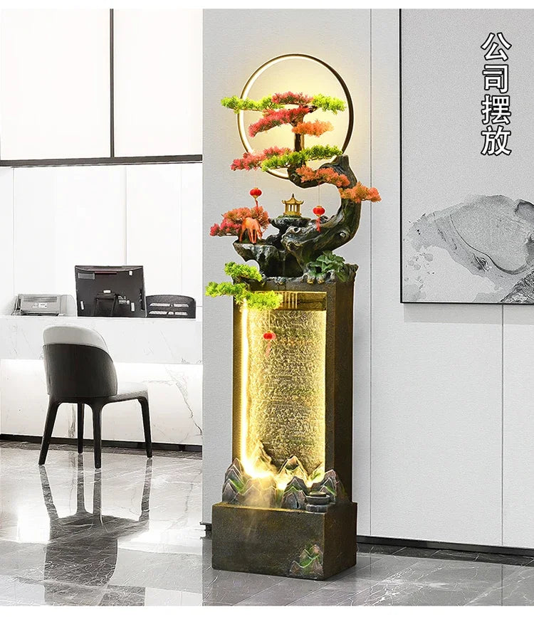 Moonlit Bonsai Waterfall displayed near an office reception desk with large windows and gray wall art.