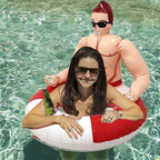 Adult woman using the Muscle Man Pool Float in a pool with a bottle in the built-in cup holder