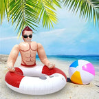 Muscle Man Pool Float on a tropical beach beside a colorful beach ball