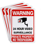 No Trespassing Security Sign shown in a stack of four matching red, white and black signs.
