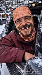 Old Man Ski Mask Missing Teeth style worn without goggles by a person leaning out of a parked car