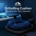 HighPeak OrthoRing Cushion in navy blue memory foam on black office chair for ergonomic tailbone support and comfort