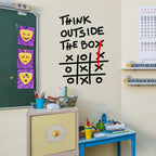 Outside The Box Decal above a classroom craft corner beside a green board and colorful pencil cups