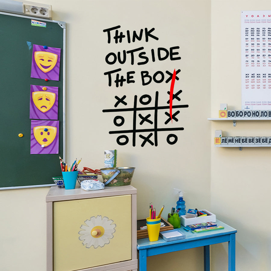 Outside The Box Decal above a classroom craft corner beside a green board and colorful pencil cups