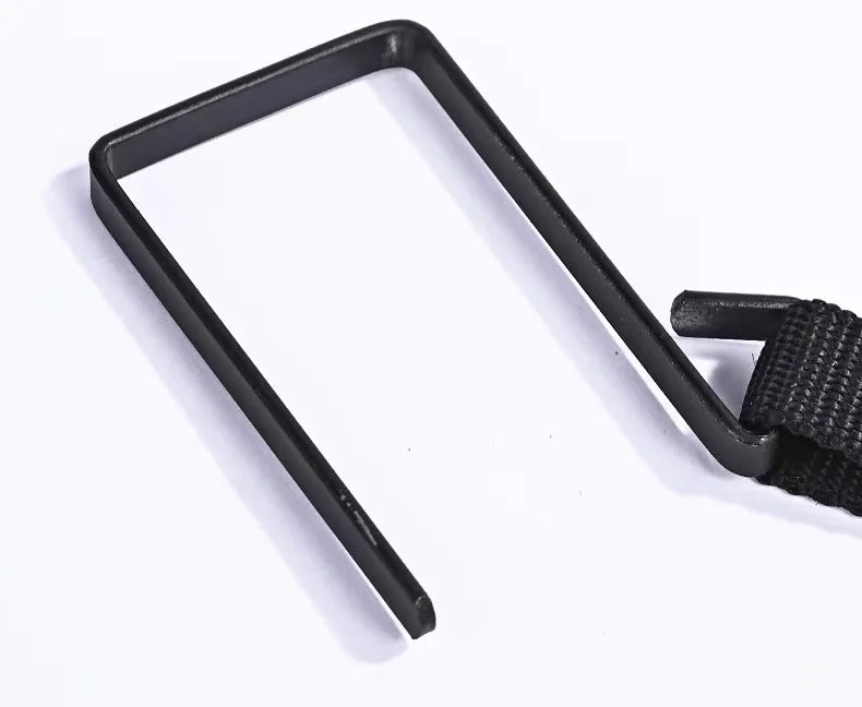 Closeup of a black over-door hook attached to the cervical traction strap