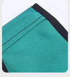 Closeup of green supplier-example sling fabric, seam and black edge binding
