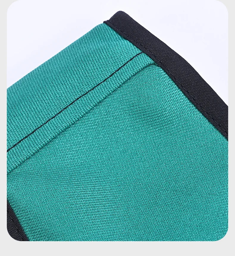 Closeup of green supplier-example sling fabric, seam and black edge binding