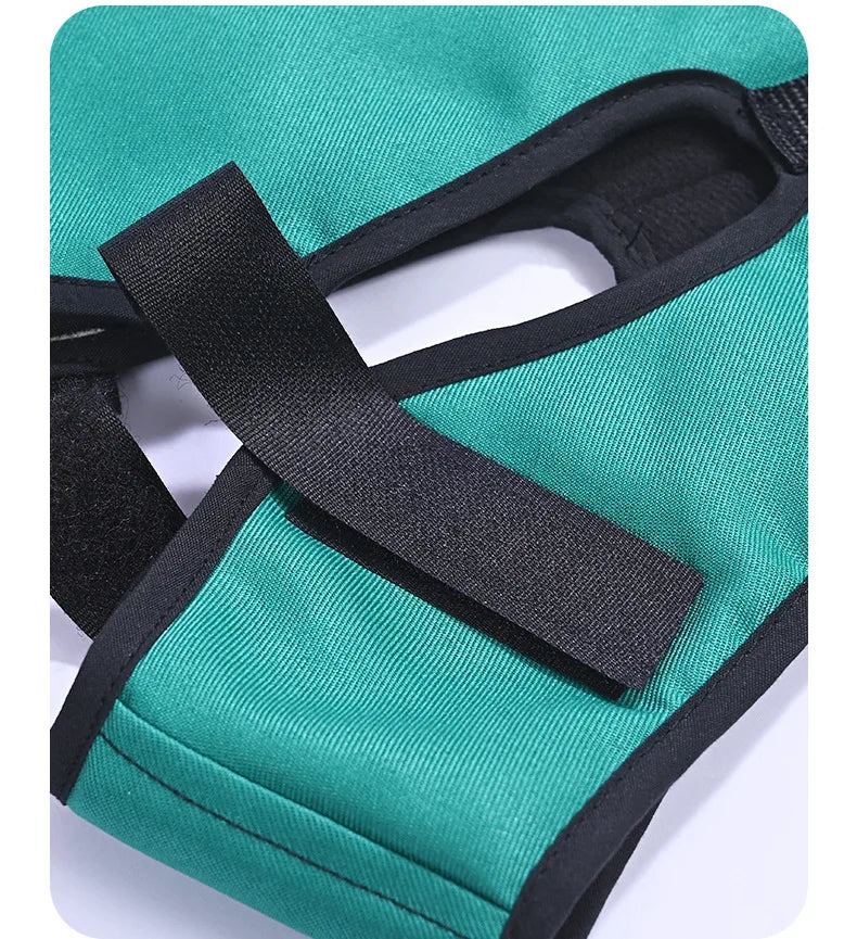Black fastening strap across the ear opening of a green supplier-example cervical traction sling